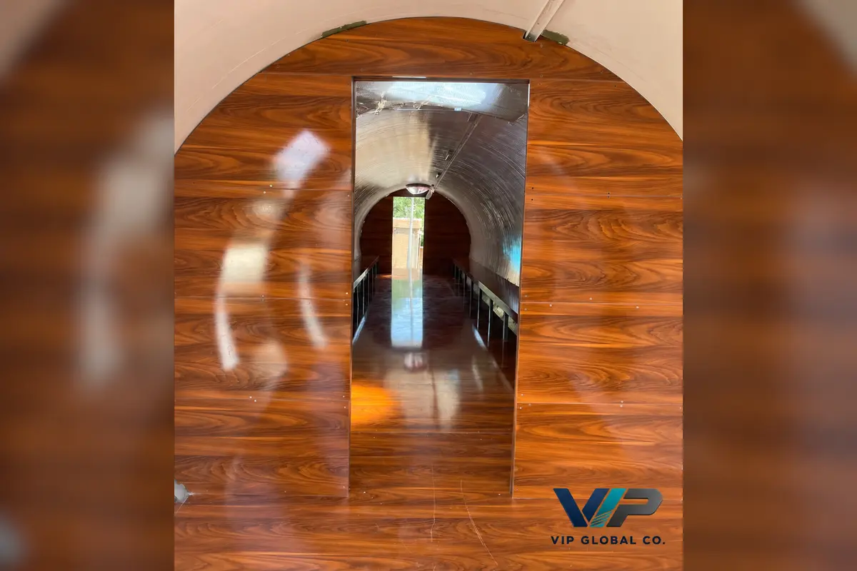 Hotel capsule entrance with a wood-effect partition and curved interior